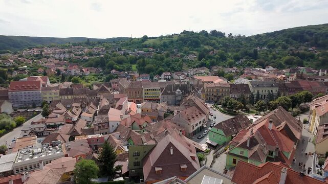 Panoramic view from Sighisoara Clock Tower over the historic city and surrounding hills in Romania