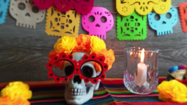 Day of the dead skull altar celebration with burning candle