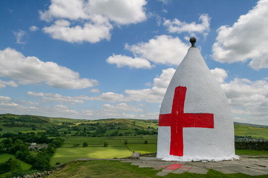 White Nancy monument featuring a painted cross of st george in Bollington
