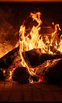 Fireplace burning wood logs. Cozy warm home in winter, Christmas time bonfire. Fire flames