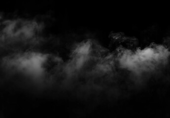Fototapeta premium Wisps of white smoke or fog drifting against a deep black background, creating an eerie and mysterious atmosphere