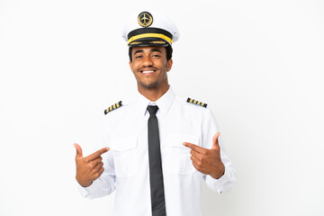 African American Airplane pilot over isolated white background proud and self-satisfied © luismolinero