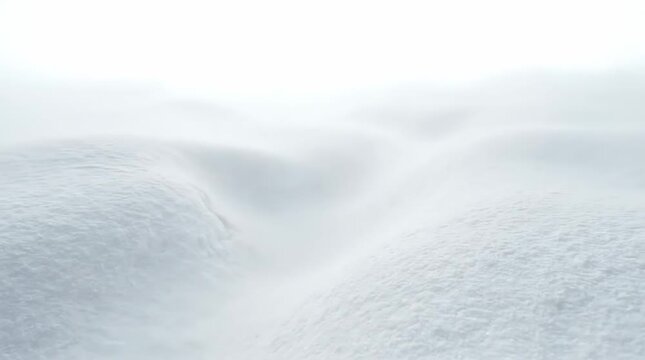 Fog rolling over snowy mountain landscape