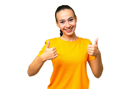 Young Arab woman over isolated background giving a thumbs up gesture