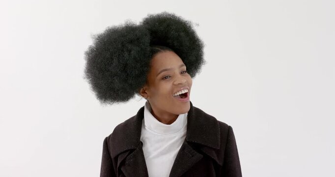 High speed photography for dynamic scenes, Smiling woman in black coat looking up, expressing surpri