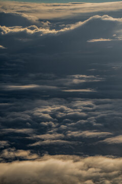 Stacked cloud formations with dense central banks and smaller rolling layers fill the atmosphere, illustrating Finnish cloud coverage for aviation weather imagery