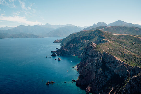 A dramatic rocky cove with clear waters along the Mediterranean coastline