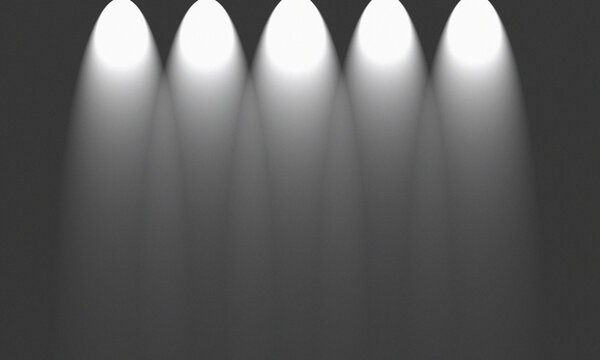 Five spotlights shining on dark background