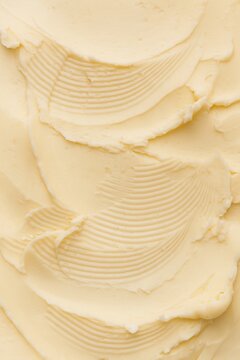 Creamy butter spread texture with ridged spatula strokes
