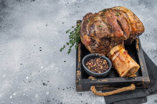 Juicy beef shank ossobuco  slow cooked with marrow bone thyme top view copy space