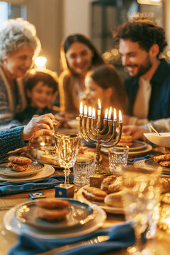 Family Hanukkah Dinner with Eight Burning Candles