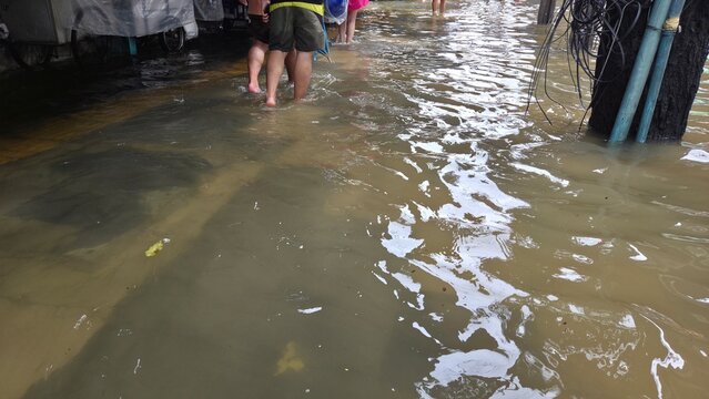 BANGKOK, THAILAND - SEPTEMBER 24, 2026: Severe street flooding in Ramkhamhaeng area near Big C Hua Mak, causing disruption to local traffic and pedestrians.