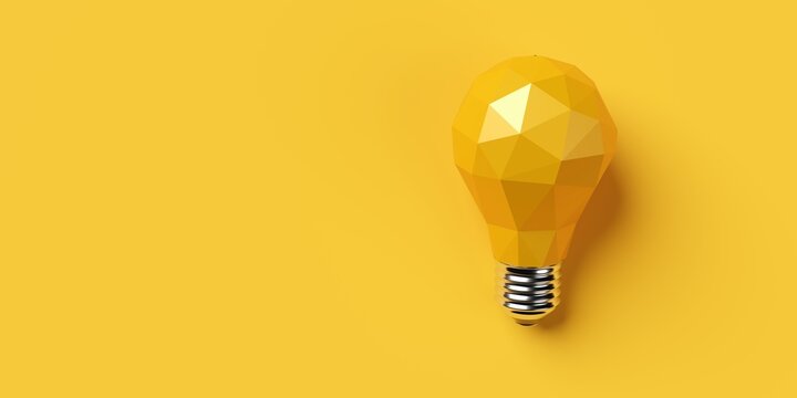 Yellow low poly light bulb on yellow background with copy space, idea, creativity or business innovation concept
