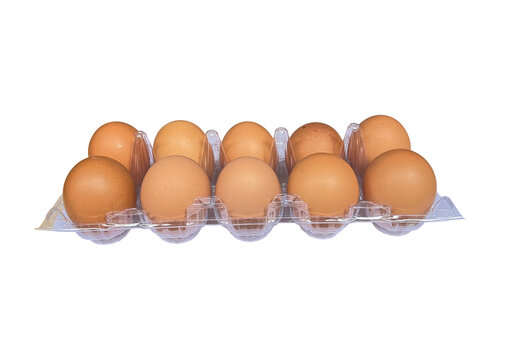 Fresh brown eggs in a clear plastic carton packaging isolated on Transparent Background