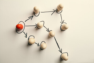 Obraz premium Conceptual image of teamwork. Group of people linked together by rope