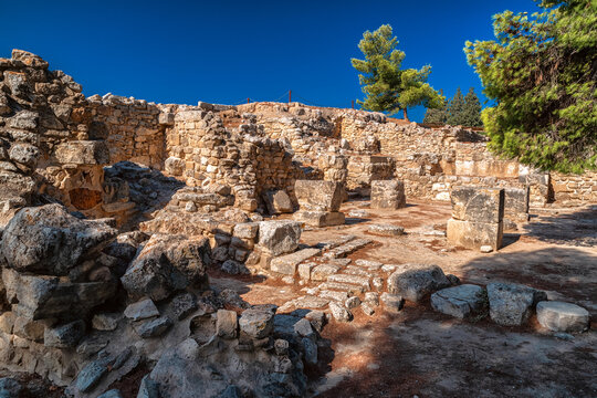 Ancient Minoan palace ruins with stone foundations at Phaistos archaeological site in Crete, Greece