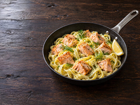 Creamy Salmon Pasta with Lemon and Fresh Dill in Skillet