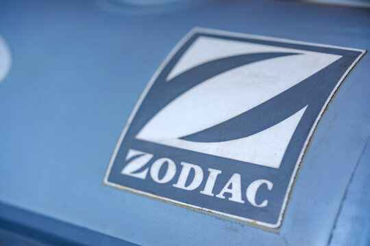 Zodiac logo in macro on blue inflatable boat fabric with shallow focus