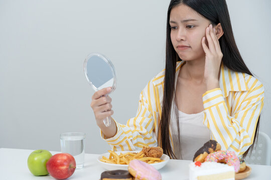 diet, women feeling unhappy during check her face on mirror, Good healthy food. weight lose, balance, control, reduce fat, low calories, routines, exercise, body shape.