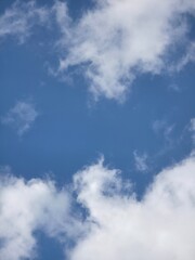 White clouds drifting across a blue sky © Oleh