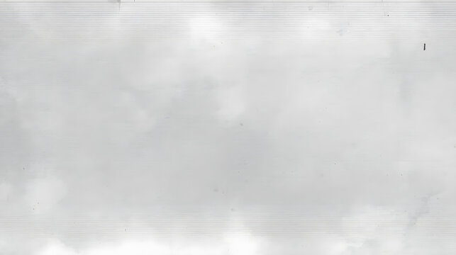 Cloudscape Serenity: A vast, serene expanse of soft, grey clouds fills the sky, hinting at a gentle, overcast day.