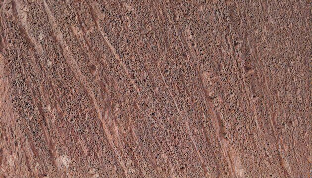 Tuff stone texture background, warm porous volcanic tuff texture in warm raking sunlight, wide banner with copy space for website header and presentation