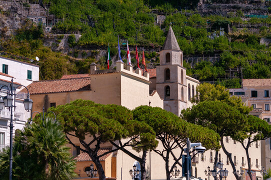 Facade of Comune di Amalfi, located on the Amalfi Coast, with its azure sea and beautiful colorful cliffside houses.