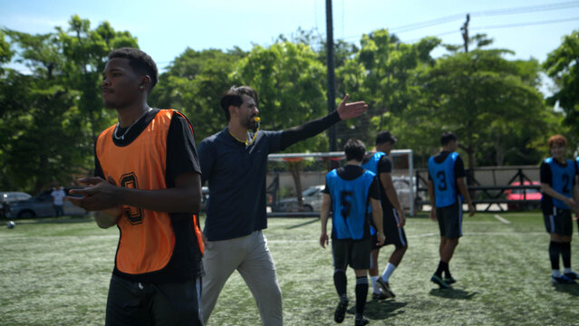 Before the match began, the referee had players from both teams shake hands to emphasize good manners,