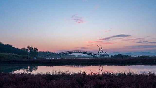 4K Night-to-day timelapse video of  sunrise timelapse of Misaeng Bridge in Siheung Gaetgol Ecological Park wetland, South Korea
