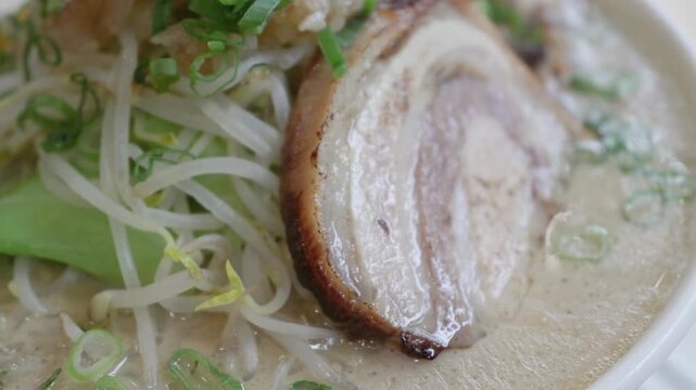 Close up of sliced pork in a bowl of Japanese ramen