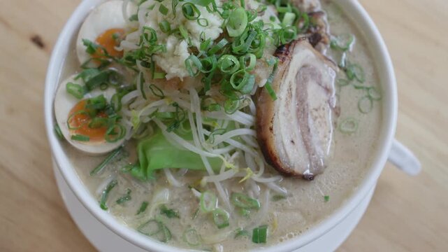 Jiro style ramen with pork egg and bean sprouts close up