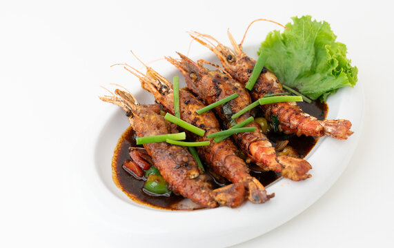 Traditional Thai red shrimp curry with chili, Coconut shrimp curry, Thai yellow curry with seafood, Spicy shrimp curry, authentic prawn masala, gourmet seafood dish on a white background