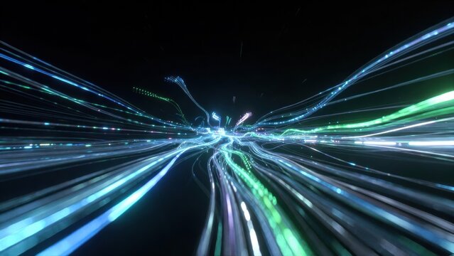 Abstract image of vibrant light trails creating an illusion of speed and movement through a dark space