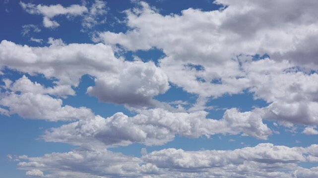 Blue Sky and Puffy Clouds Timelapse Background