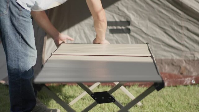 Setting Up a Camping Table in a Backyard