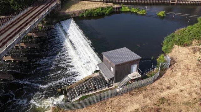 Aerial view of river weir generating hydroelectric power