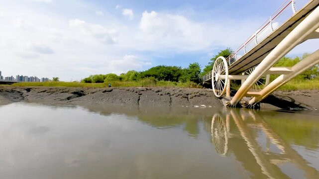 4K slow motion aerial drone shot of Misaeng Bridge over scenic tidal flats in Siheung, South Korea.
