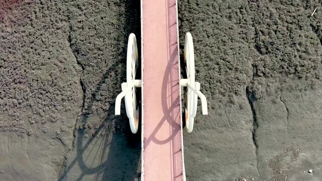 4K slow motion aerial drone shot of Misaeng Bridge over scenic tidal flats in Siheung, South Korea.