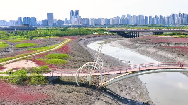 4K slow motion aerial drone shot of Misaeng Bridge over scenic tidal flats in Siheung, South Korea.