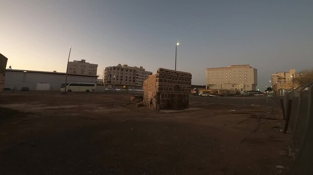 Islamic fenced ancient stone ruins at dusk in Medina, Saudi Arabia.
