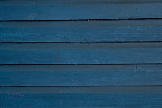 Dark blue painted wood texture with repeating horizontal boards