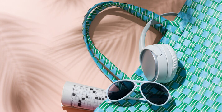 Turquoise Beach Bag with Headphones, Sunglasses and Crossword Puzzle