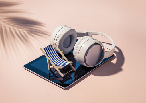 Miniature Beach Chair and Headphones on Tablet for Summer Relaxation