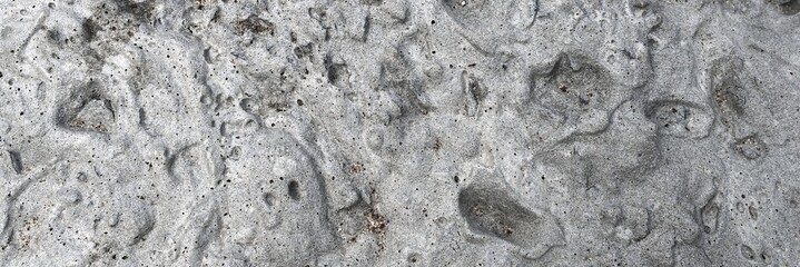 Gray concrete texture creating an abstract pattern background © Harry