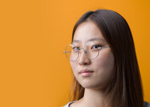 Portrait of Young Chinese Woman with Round Wire-Frame Eyeglasses