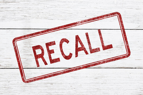 Recall red distressed stamp on weathered wood