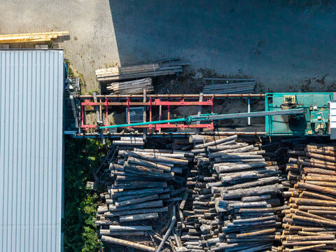 Sawmill processing timber logs, aerial view of wood industry and forestry
