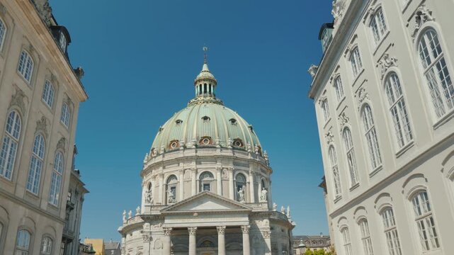 Frederik's church known as marble church, a beautiful historical landmark with an imposing green dome under blue sky on a sunny day in copenhagen, denmark.