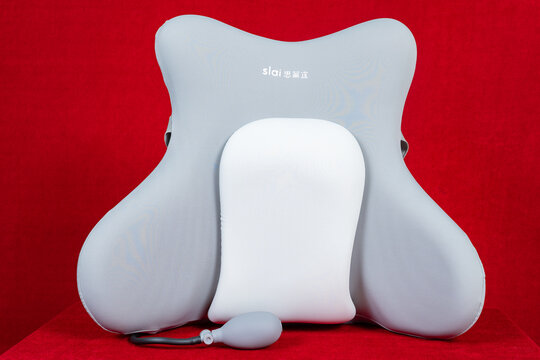 ZhongShan GuangDong China-September 20 2026: Slai back support cushion with inflatable lumbar pillow on red.