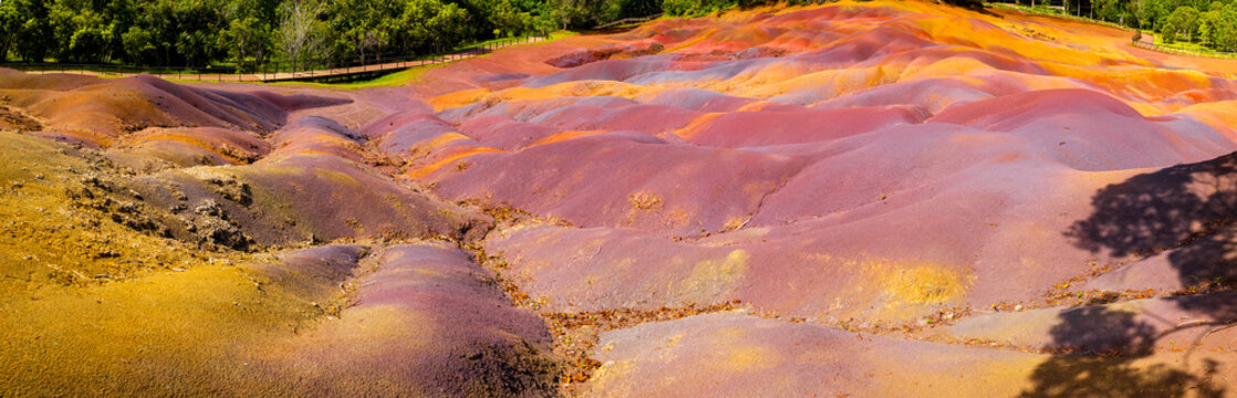 Chamarel Seven Colored Earth Geopark in Mauritius Island. Colorful panoramic landscape about this volcanic geological formation Chamarel Seven Colored Earth Geopark in Riviere noire district.